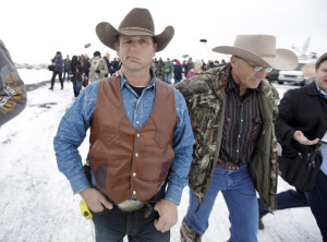 Armed Ryan Bundy standing with now-deceased LaVoy Finicum in Oregon (Photo via AP)